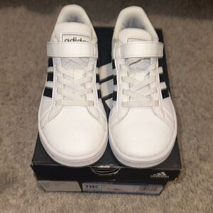 Black and white kids adidas. Size 11.